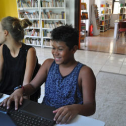 smiling-boy-on-laptop-rio-de-janeiro