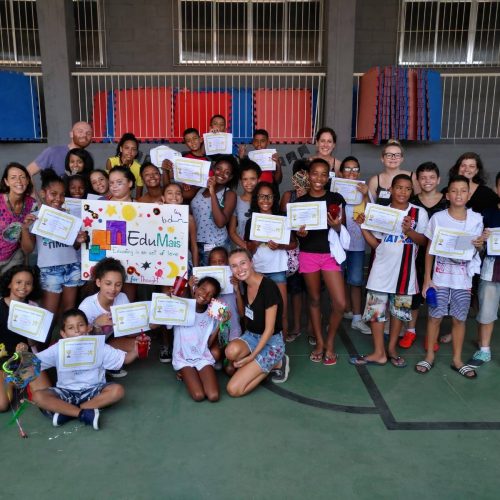 Students and volunteers on EduMais's English Summer Camp 2019 display their certificates of participation