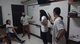 One EduMais students attempts to guess the verb charade another team are performing in EduMais's extracurricular English class